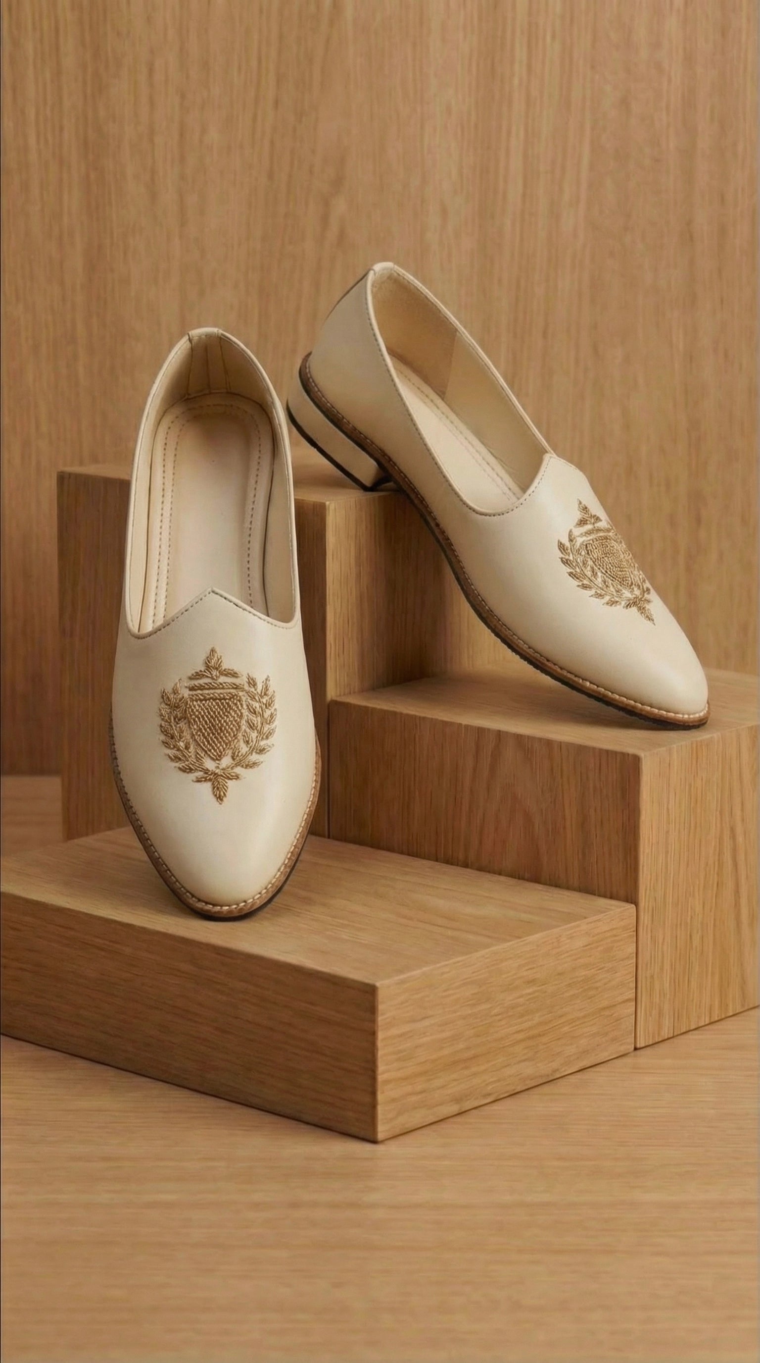 Cream Leather Mojdi Shoes with Gold Crest Embroidery | Dresswala NX