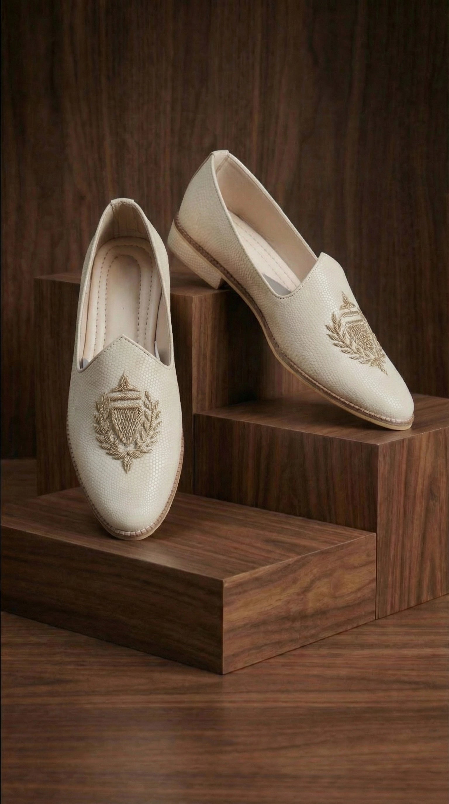 Ivory Crest Textured Mojdi Shoes with Gold Crest Embroidery | Dresswala NX