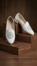 Ivory Textured Mojdi Shoes with Silver Crest Embroidery | Dresswala NX